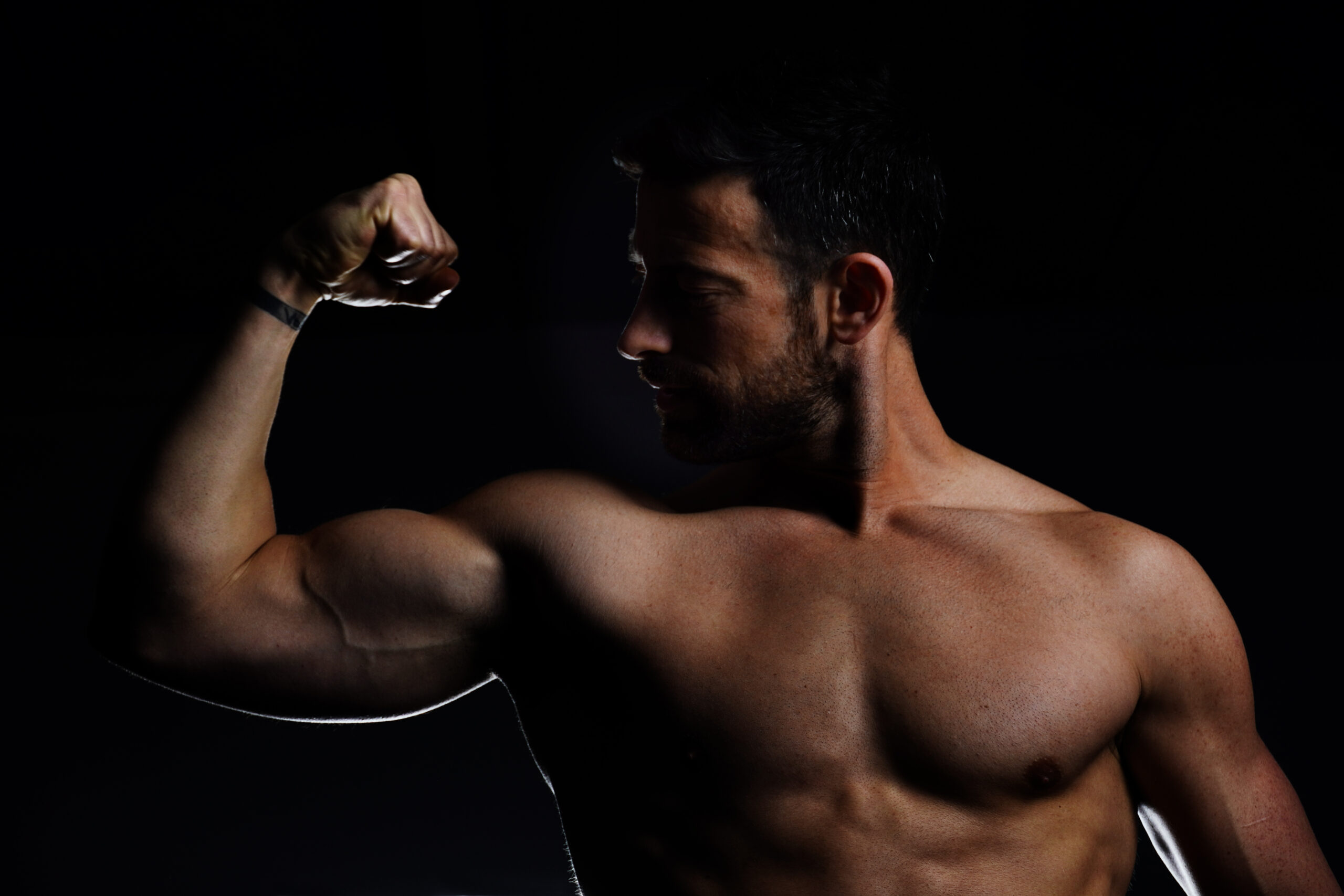 Personal Trainer Flexing Biceps