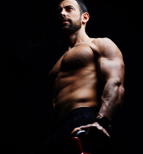 Schreded Athlete training with Kettlebell